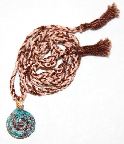 Shell pendant paved diamond rondell with hand woven cord